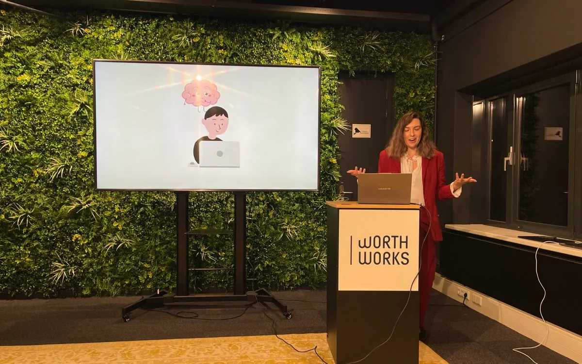 Maria giving a talk on behavioral science to a team